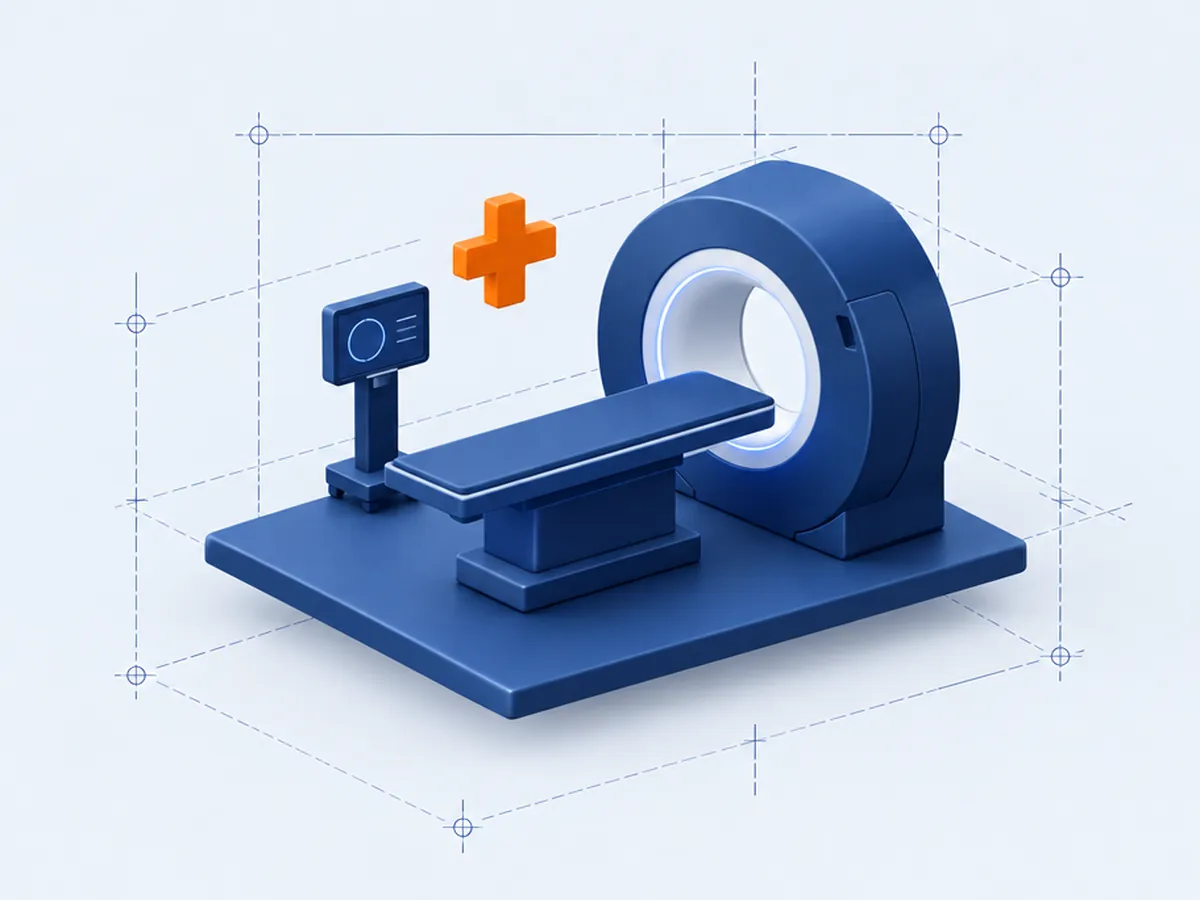 Maqueta de una camilla, un equipo de imagen médica y un monitor, con una cruz naranja